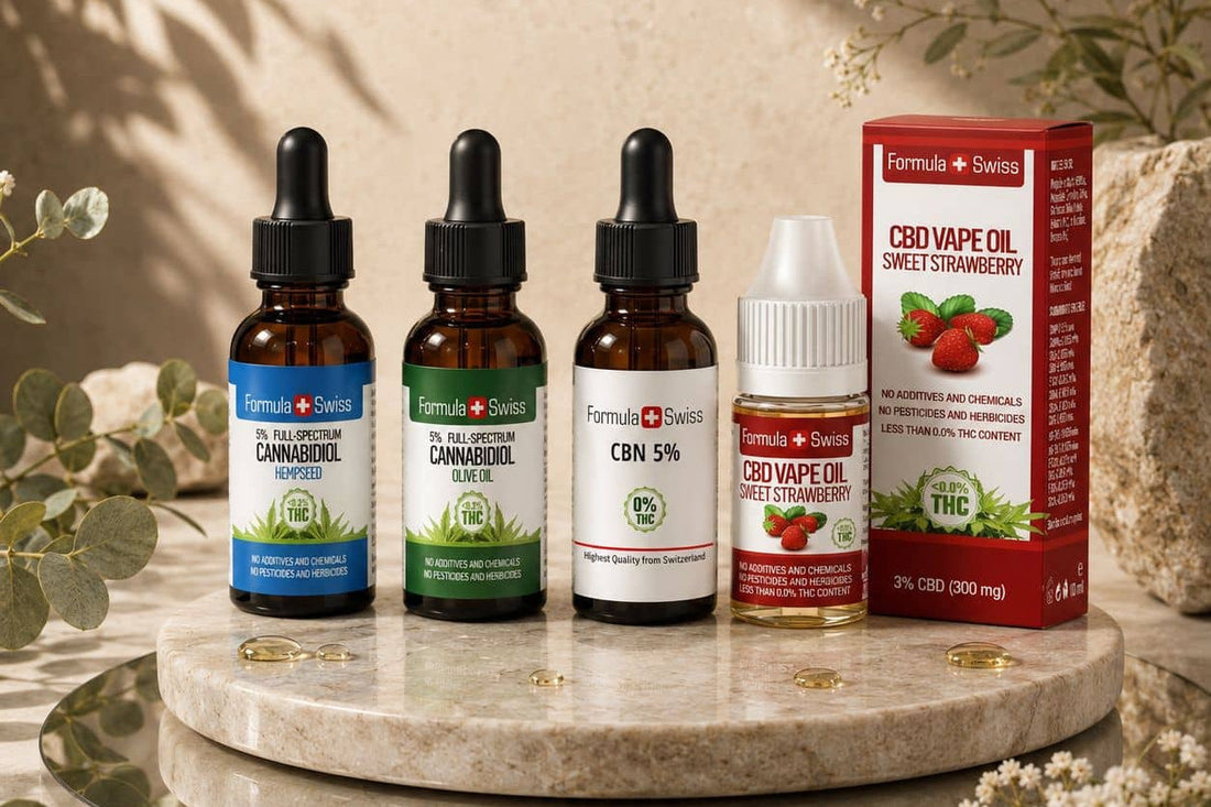 Uleiuri CBD Formula Swiss 5% în ulei din semințe de cânepă și ulei de măsline, ulei CBN 5% și un ulei vape CBD cu aromă de căpșuni pe un suport de marmură